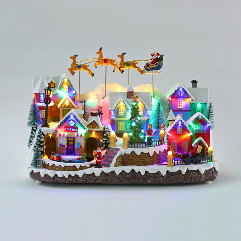 ACA Lighting LED XMAS VILLAGE WITH MOVING SANTA TRAIN DEER CHILDREN &MUSIC RGB 3AA BATTERIES(NOT INCLUDED) 425*240*310mm — manufacturer representative image